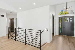 Entrance foyer featuring light wood-style flooring, recessed lighting, and a chandelier