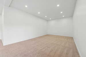 Unfurnished room featuring recessed lighting and light carpet