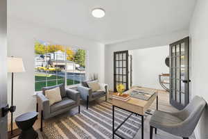 Living area featuring wood finished floors and french doors