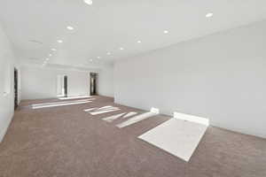 Unfurnished room with recessed lighting and carpet floors