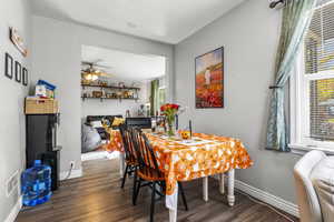 Dining space featuring wood finished floors and ceiling fan