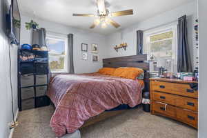 Bedroom featuring carpet flooring and ceiling fan
