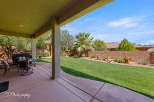 Fenced backyard featuring a patio