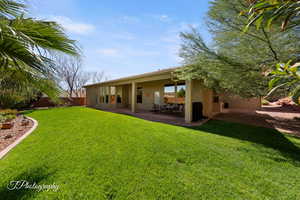 Back of property featuring stucco siding and a patio