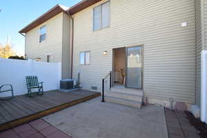 Back of house featuring a patio, a deck, and entry steps