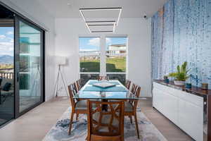 Dining space featuring wood finished floors and baseboards