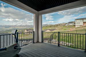Loft deck with a residential view and a mountain view