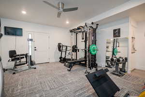 Basement exercise area with recessed lighting and ceiling fan