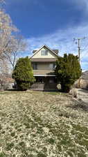 View of side of home with covered porch