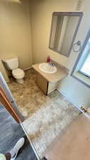 Bathroom with vanity and stone finish floors