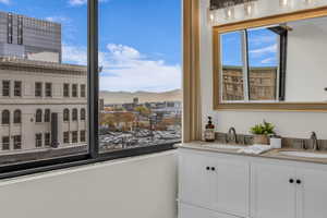 Bathroom with a mountain view and double vanity