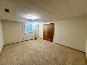 Unfurnished bedroom featuring carpet floors and a closet