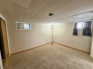 Basement with carpet and baseboards