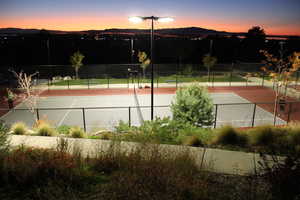 View of tennis court featuring a mountain view