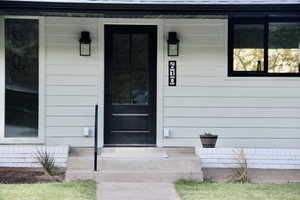 Property entrance with covered porch