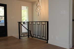 Entryway featuring wood finished floors and baseboards