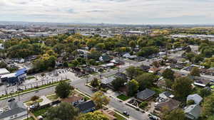 Aerial overview of property's location featuring nearby suburban area