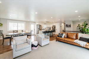 Living room featuring recessed lighting and light wood-style flooring