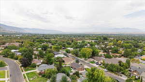 Aerial view of residential area featuring mountains