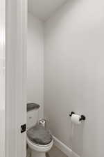 Bathroom with baseboards and light wood finished floors