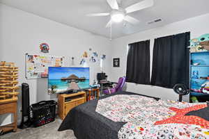 Bedroom featuring carpet flooring and a ceiling fan
