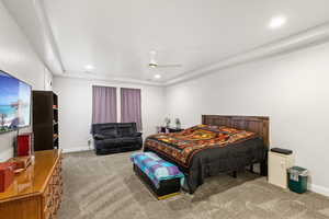 Carpeted bedroom featuring recessed lighting and ceiling fan