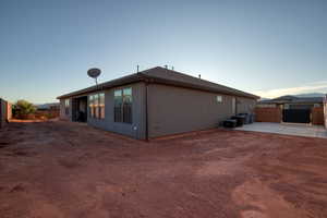 Back of property with a fenced backyard