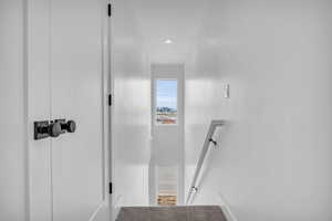 Stairway featuring recessed lighting