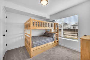 Bedroom with carpet flooring and baseboards