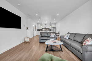 Living room featuring recessed lighting and light wood finished floors