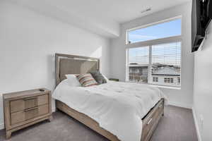 Bedroom with carpet flooring and baseboards