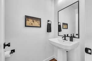 Bathroom with baseboards and a sink