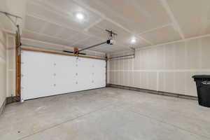 Garage featuring a garage door opener