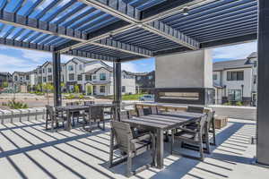View of patio with a pergola and outdoor dining space