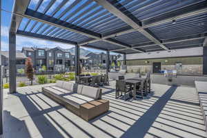 View of patio / terrace featuring a residential view, area for grilling, outdoor dining space, a pergola, and an outdoor living space