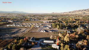 Aerial overview of property's location with a mountainous background