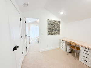 Office area with light carpet, vaulted ceiling, and recessed lighting