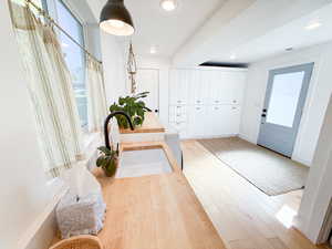 Foyer entrance featuring wood finished floors and recessed lighting