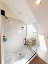Full bath featuring a shower stall