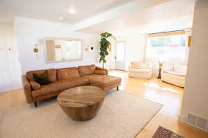 Living room with light wood-style flooring