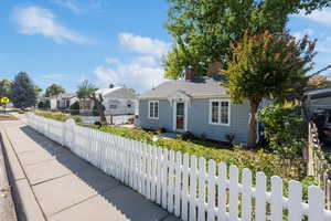 White picket fence. Curb and gutter make for great walking neighborhoods!