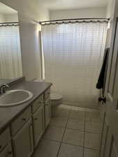 Bathroom featuring vanity and light tile patterned floors
