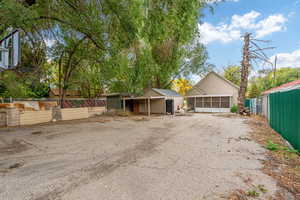 View of front of home with a sunroom and a garage