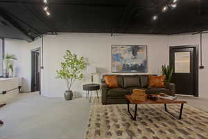 Living room with finished concrete floors