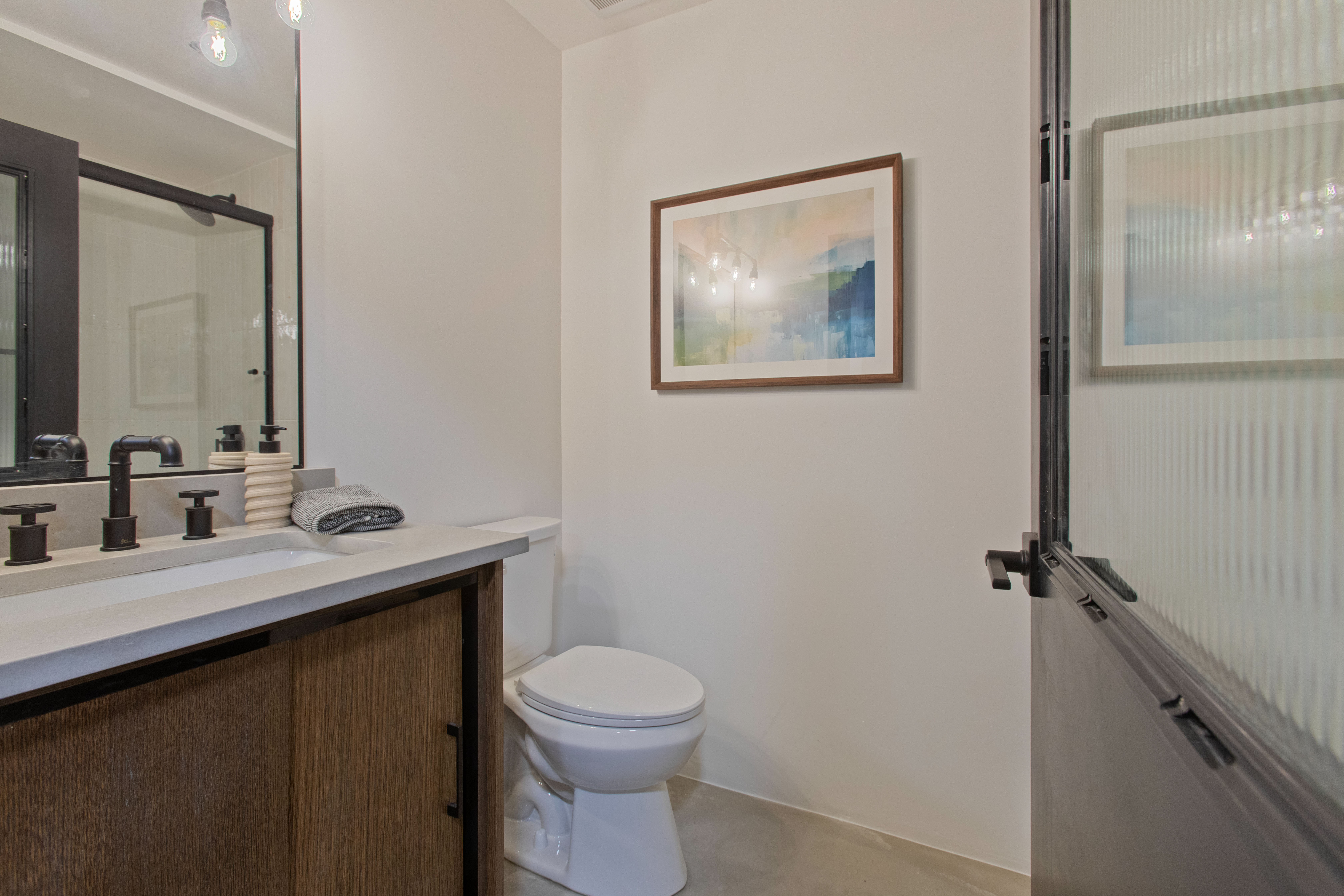 Full bath featuring vanity and toilet