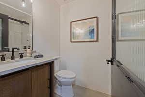 Full bath featuring vanity and toilet