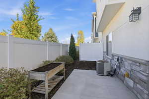 View of patio with a vegetable garden