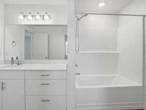 Full bathroom with vanity and tub / shower combination