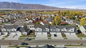 Aerial view of residential area featuring mountains
