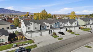 Aerial perspective of suburban area with a mountainous background
